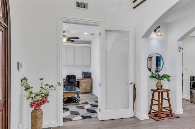 hallway featuring light hardwood / wood-style flooring