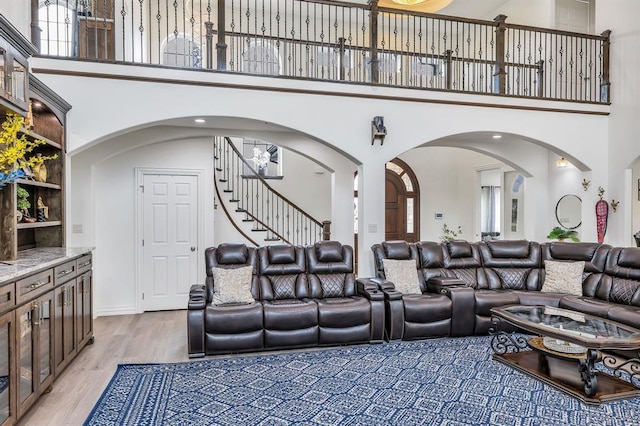 living room featuring hardwood / wood-style floors and a high ceiling