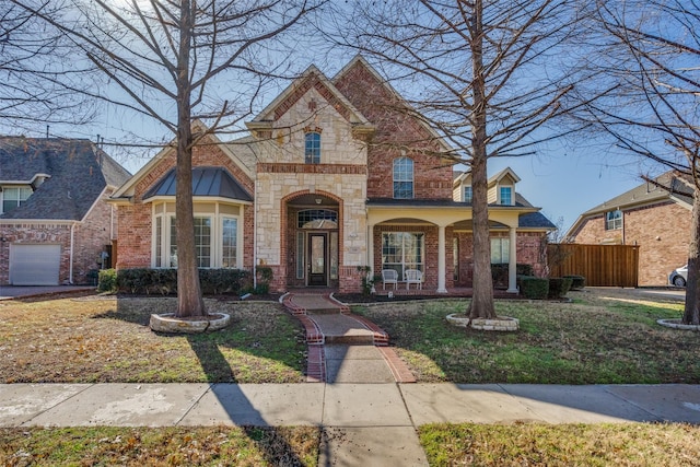 front facade featuring a garage and a front lawn