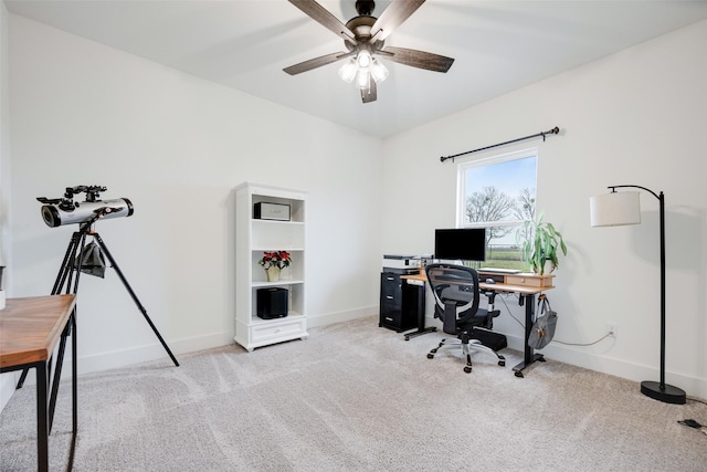 office area with ceiling fan and light carpet