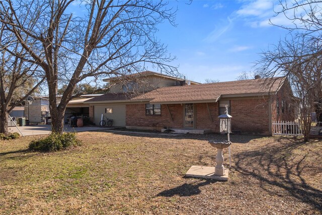 ranch-style home featuring a carport