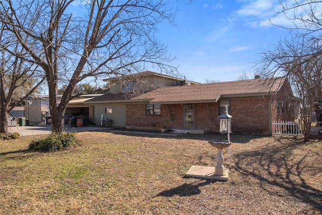 rear view of house with a yard