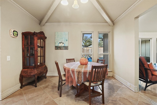 dining area featuring ornamental molding and vaulted ceiling with beams