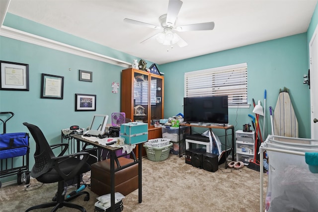 office space with light carpet and ceiling fan