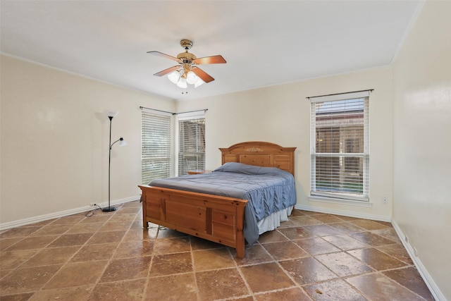 bedroom with ornamental molding and ceiling fan