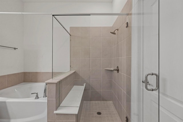 bathroom with separate shower and tub