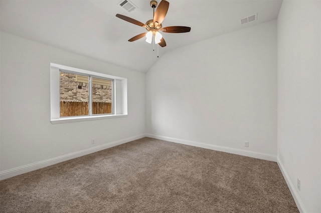 unfurnished room with ceiling fan, lofted ceiling, and carpet floors