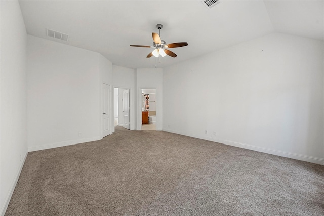 unfurnished room with ceiling fan, vaulted ceiling, and carpet