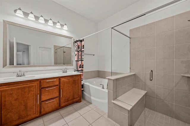 bathroom featuring tile patterned flooring, vanity, and separate shower and tub