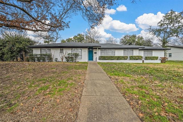 ranch-style home with a front yard