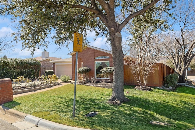 view of front facade featuring a garage and a front lawn