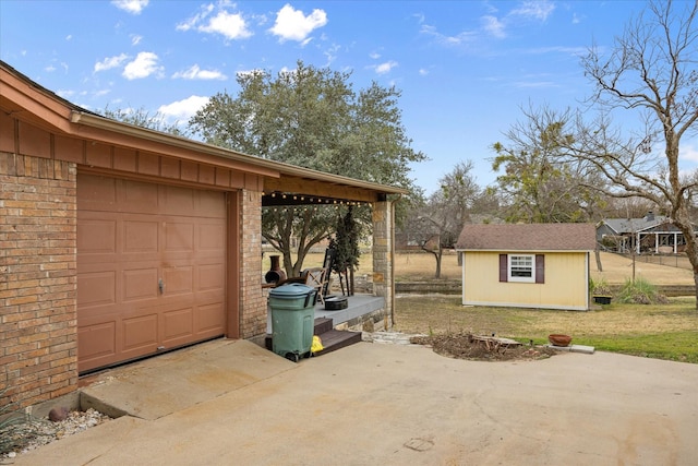 garage with concrete driveway