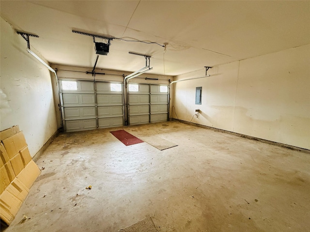 garage featuring a garage door opener and electric panel