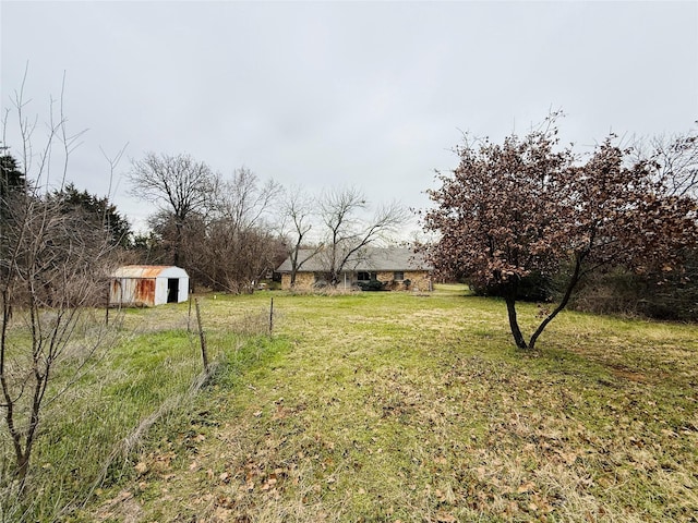 view of yard with a shed and an outdoor structure