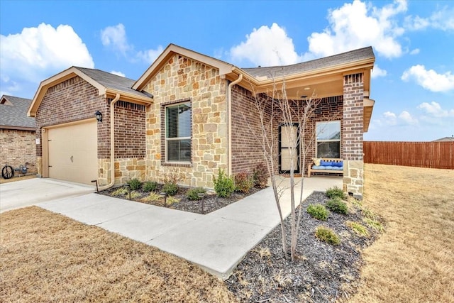 ranch-style house with a garage and a front lawn