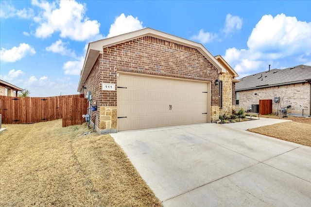 view of front of property featuring a garage and a front yard