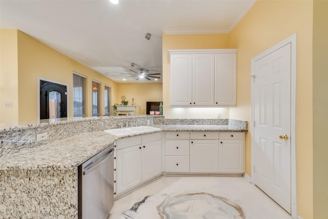 kitchen featuring sink, dishwasher, light stone countertops, white cabinets, and kitchen peninsula