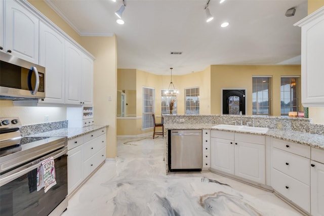 kitchen with stainless steel appliances, sink, and white cabinets