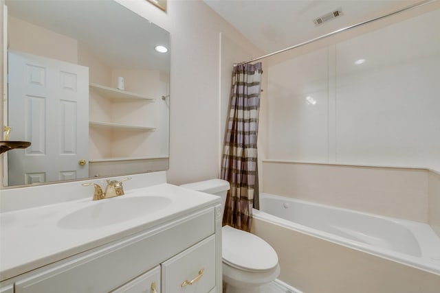 full bathroom with vanity, shower / bath combo, and toilet