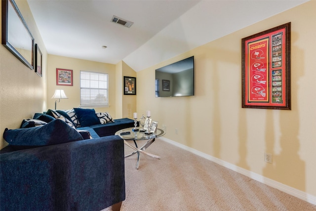 living room with lofted ceiling and carpet floors