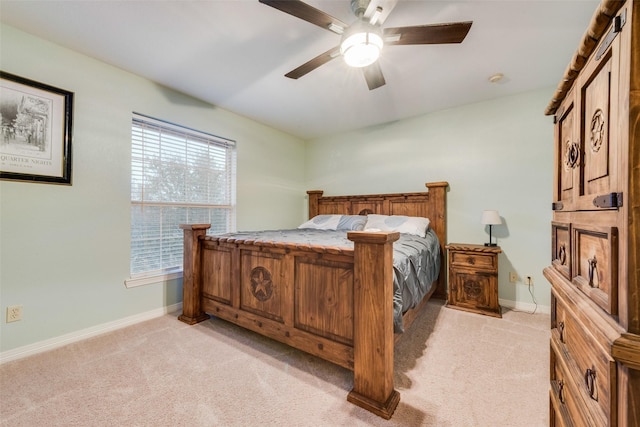 bedroom with ceiling fan and light colored carpet