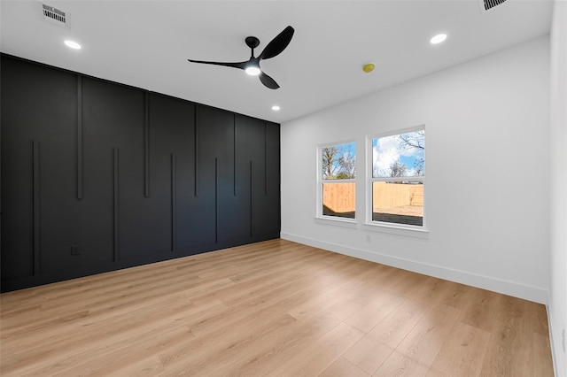 unfurnished bedroom featuring ceiling fan and light wood-type flooring