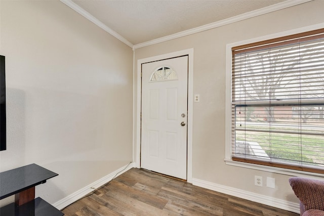 foyer entrance with crown molding and wood-type flooring