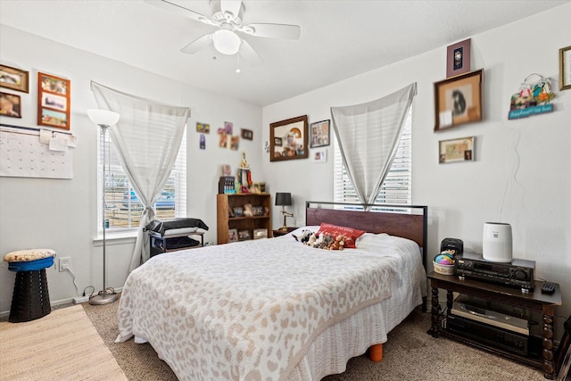 carpeted bedroom with ceiling fan