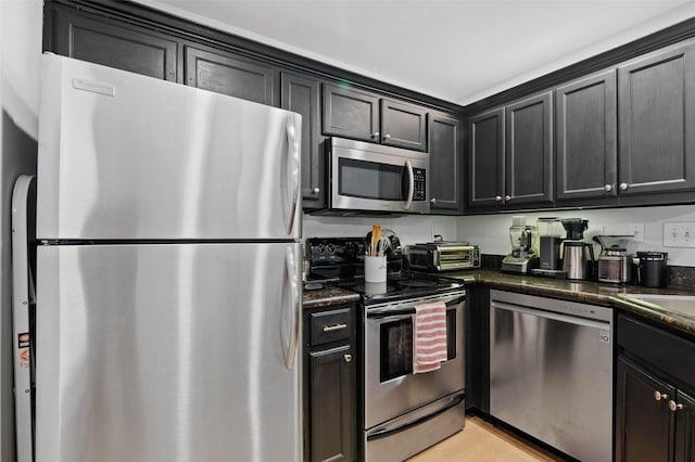 kitchen featuring stainless steel appliances and light wood-type flooring