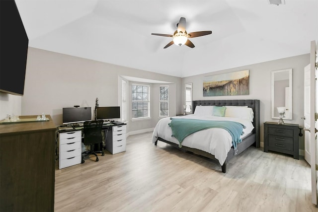 bedroom featuring ceiling fan, lofted ceiling, and light hardwood / wood-style flooring