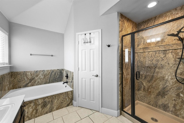 bathroom with lofted ceiling, separate shower and tub, tile patterned flooring, and vanity