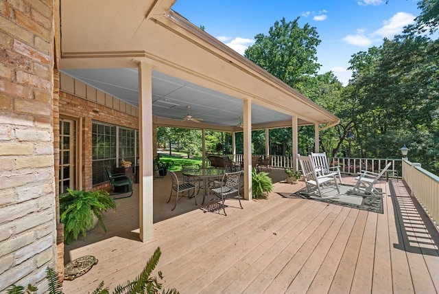 wooden terrace featuring ceiling fan