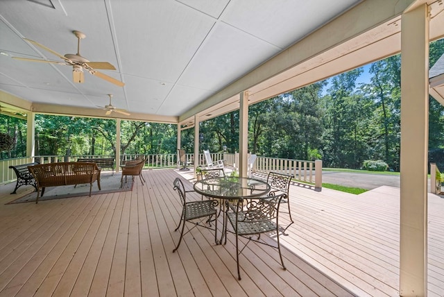 wooden terrace featuring ceiling fan