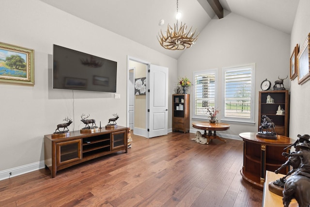 interior space with an inviting chandelier, wood finished floors, high vaulted ceiling, beamed ceiling, and baseboards