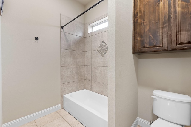 bathroom with toilet, shower / bathtub combination, baseboards, and tile patterned floors