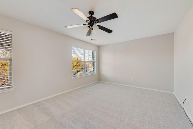 carpeted empty room with ceiling fan