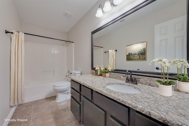 full bathroom with tile patterned flooring, vanity, shower / bath combo with shower curtain, and toilet