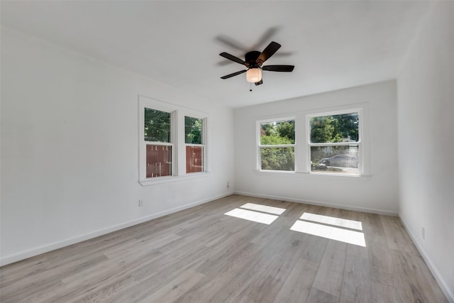 empty room featuring ceiling fan and light wood-type flooring