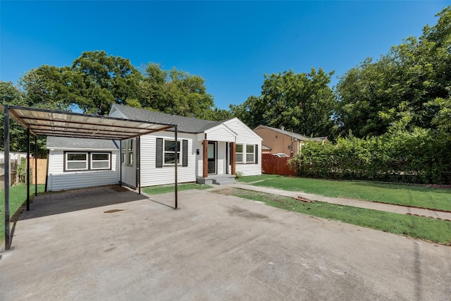 single story home with a carport and a front lawn