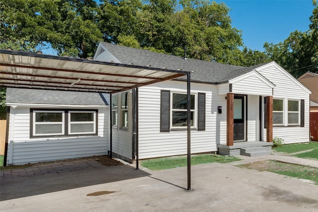 view of front of home featuring a carport