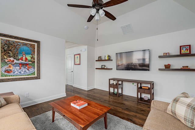 living room featuring ceiling fan, dark hardwood / wood-style floors, and vaulted ceiling