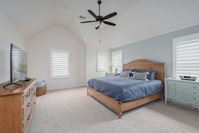 carpeted bedroom featuring lofted ceiling and ceiling fan