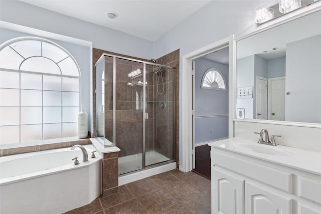 bathroom featuring vanity, shower with separate bathtub, and tile patterned flooring