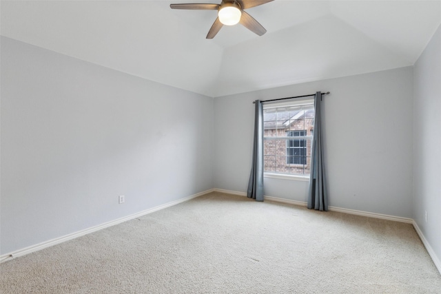 unfurnished room featuring lofted ceiling, light carpet, and ceiling fan