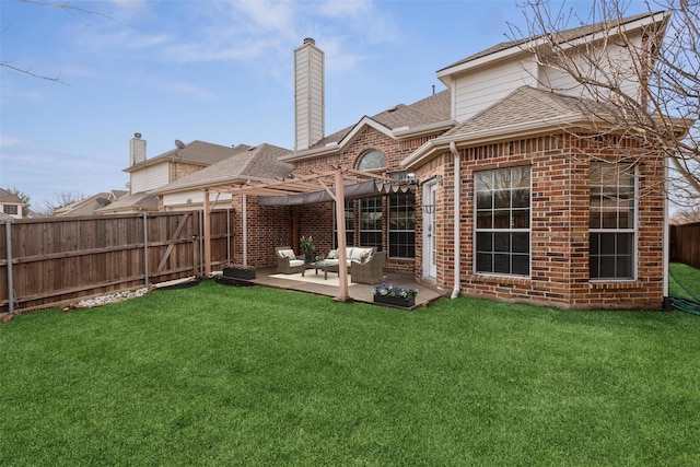 back of house with a patio, a yard, and a pergola