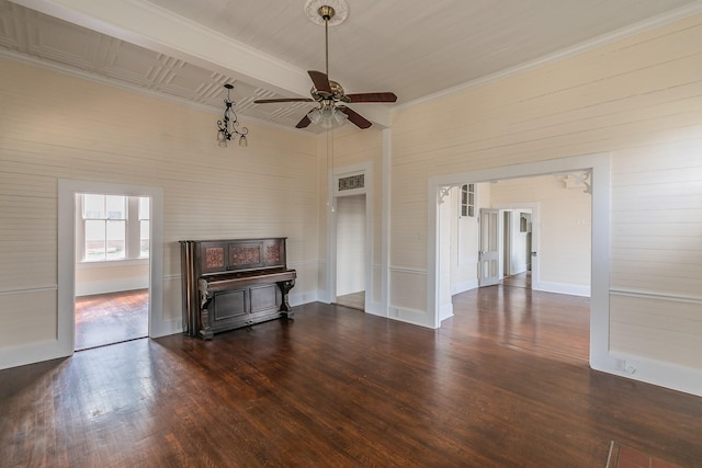 unfurnished living room featuring ceiling fan and dark hardwood / wood-style floors