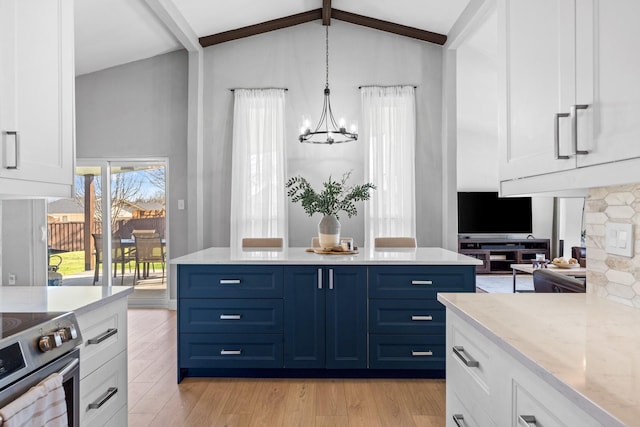 kitchen with white cabinetry, decorative light fixtures, light hardwood / wood-style floors, and blue cabinetry