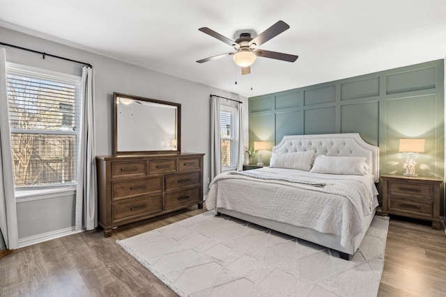 bedroom featuring ceiling fan and wood-type flooring