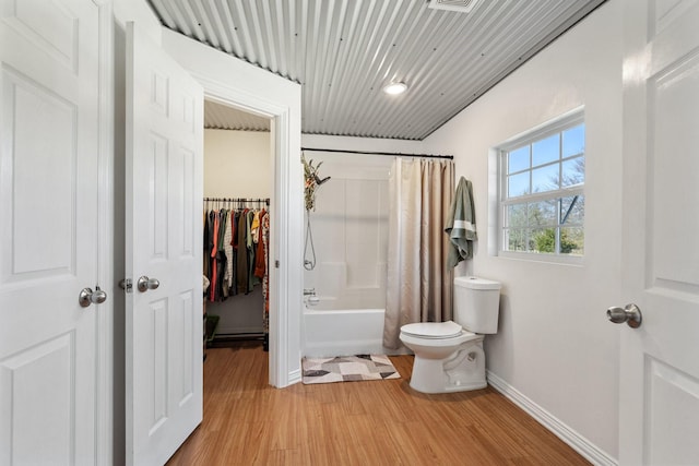 bathroom with shower / bath combination with curtain, wood ceiling, toilet, and hardwood / wood-style flooring