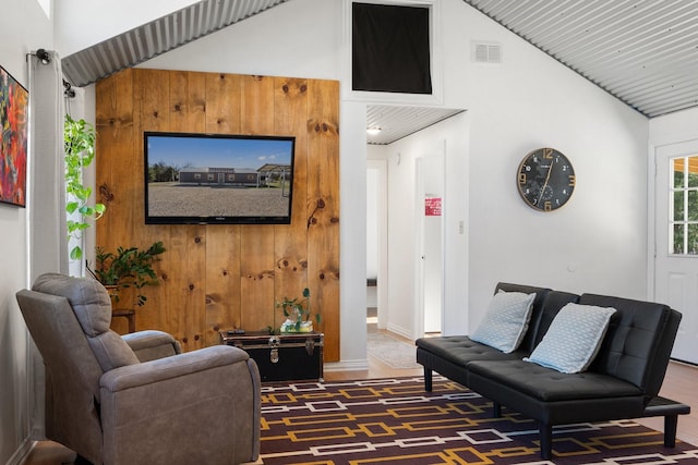 living room featuring high vaulted ceiling